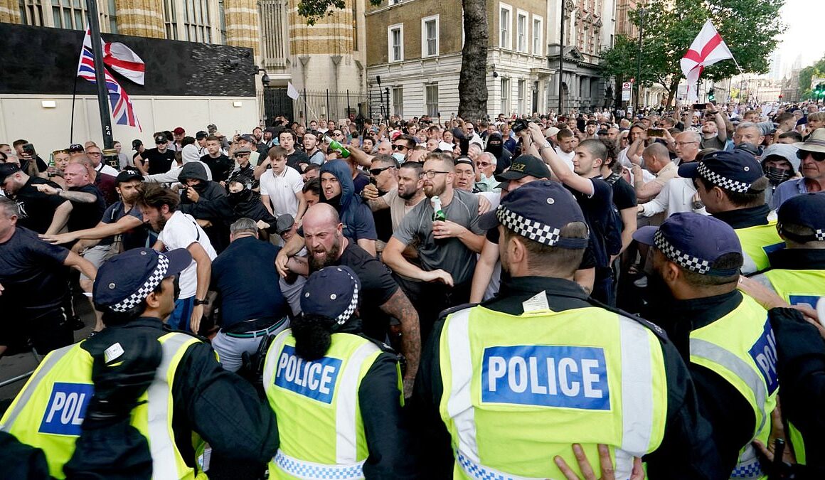 Met Police reveal 111 arrests during Whitehall riots over Southport mass stabbing that saw bottles, flares and fists rain down on officers