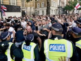 Met Police reveal 111 arrests during Whitehall riots over Southport mass stabbing that saw bottles, flares and fists rain down on officers