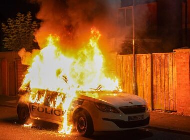 Boy, 11, is arrested on suspicion of arson after police car was set alight during protests in Hartlepool