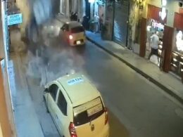 Frightening moment taxi is nearly crushed after balcony collapse in Colombia