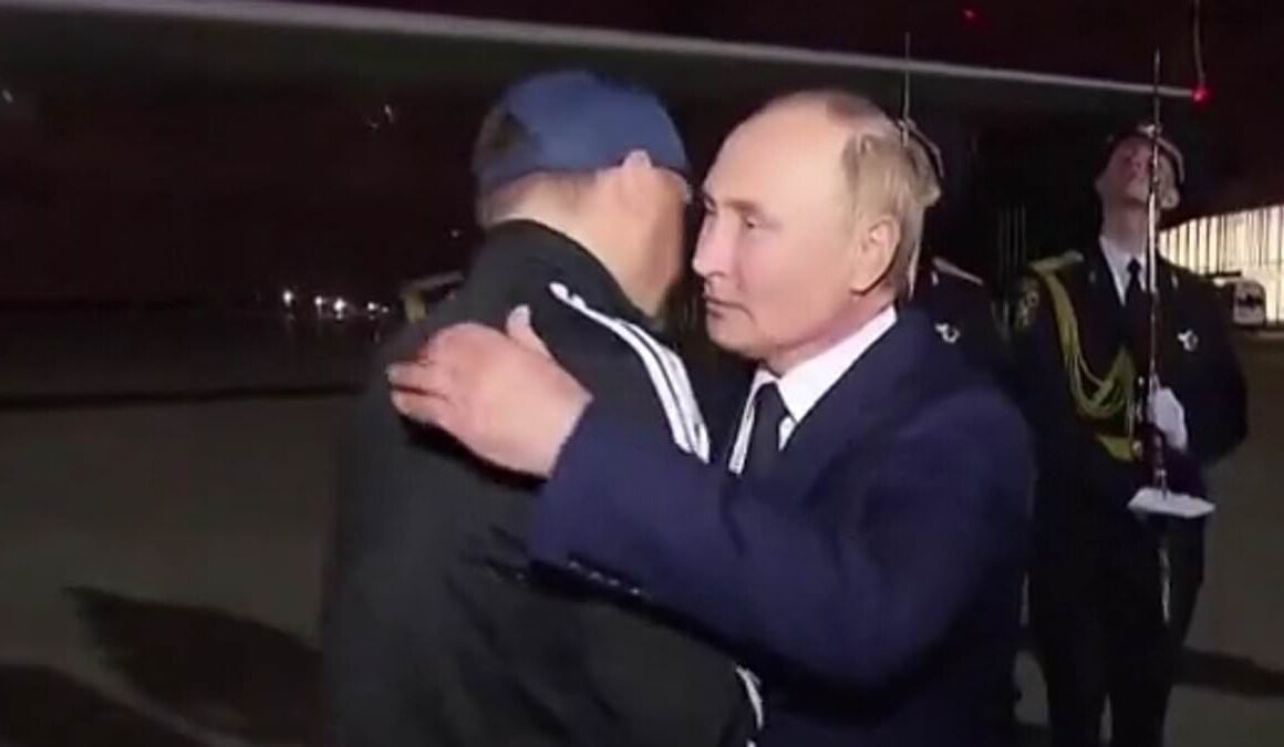 Gloating Putin greets Russians with hugs and kisses as they return to Moscow after complex prisoner swap with Western countries