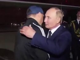 Gloating Putin greets Russians with hugs and kisses as they return to Moscow after complex prisoner swap with Western countries