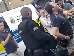 Moment police dog delivers instant karma to beer can-swilling protester goading officers and shouting ‘I pay your wages’ during riots in Hartlepool