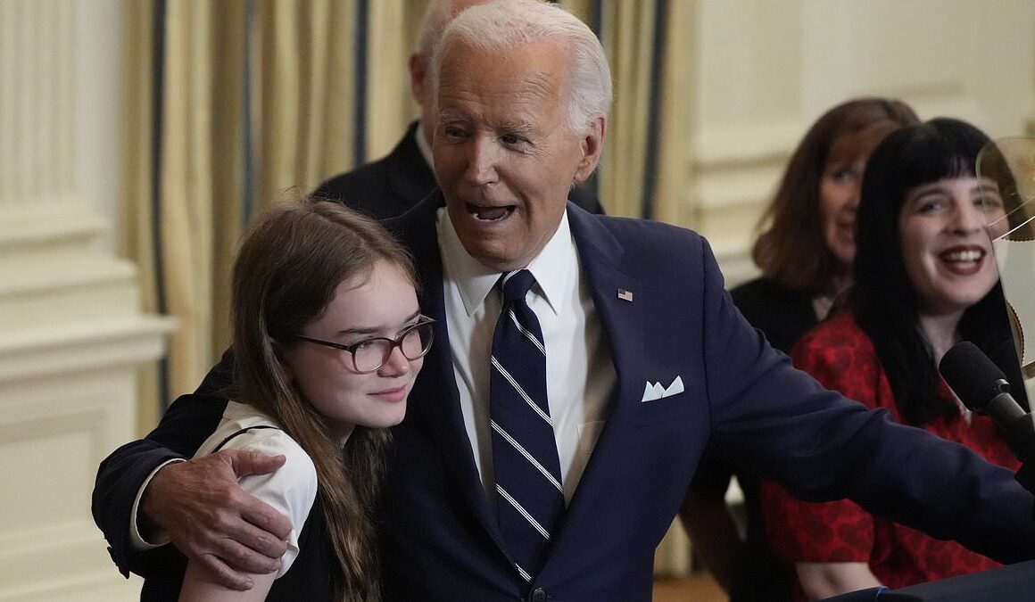 Awkward moment Joe Biden tells freed prisoner’s 12-year-old daughter ‘no serious guys until you’re 30’ as he puts an arm around her and leads ‘Happy Birthday’ chant