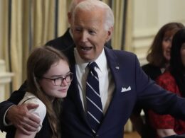 Awkward moment Joe Biden tells freed prisoner’s 12-year-old daughter ‘no serious guys until you’re 30’ as he puts an arm around her and leads ‘Happy Birthday’ chant