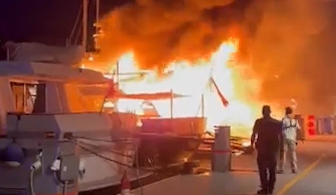 Millions of pounds goes up in smoke: Moment massive inferno destroys two luxury superyachts and a tourist boat at Greek port