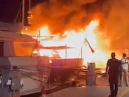 Millions of pounds goes up in smoke: Moment massive inferno destroys two luxury superyachts and a tourist boat at Greek port