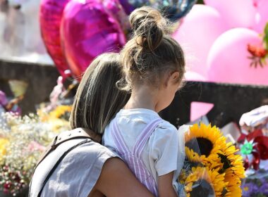 Buildings will light up in pink to remember Southport stabbing victims as Taylor Swift fans, Steven Gerrard and Anthony Gordon donate to fundraising efforts