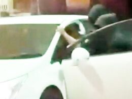 Moment masked machete gang rob driver at knifepoint as he stops to fill up petrol – as police hunt carjackers