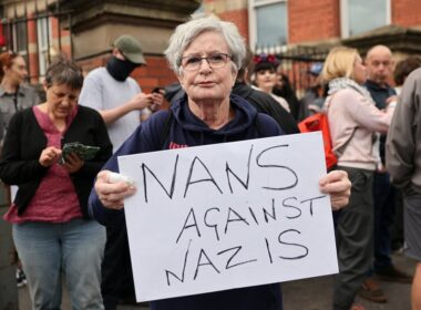 Nans against Nazis: Defiant Scouse pensioner, 71, takes to the frontline in Liverpool to protect mosque from ‘far-right protesters’ amid another night of rioting in Britain