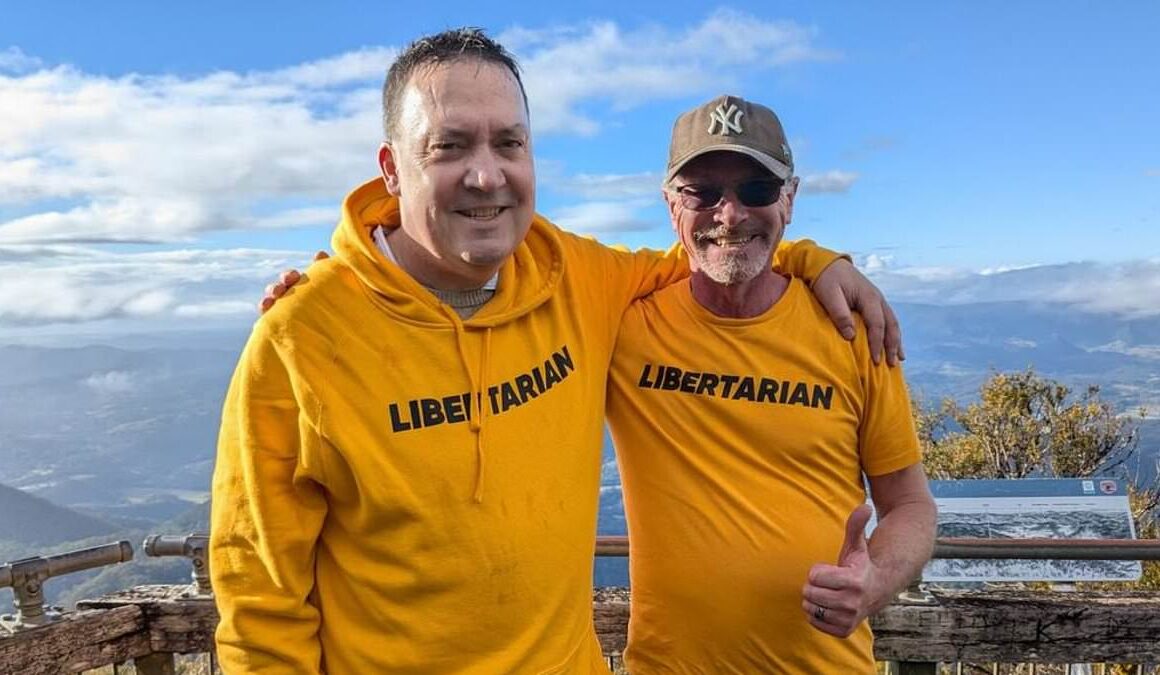 Wollumbin-Mount Warning: Act of defiance as state MP and protester ignore ban on climbing Indigenous landmark in secret early morning hike – a day after one of them was fined for breaking the rule