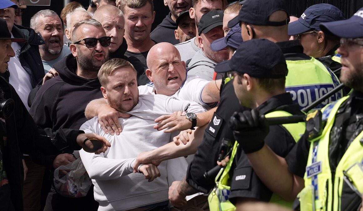 Riots break out in Manchester and Hull as police seen battling thugs amid reports of ‘stabbing’ in Stoke while chaos from protests organised after Southport horror continues across the UK