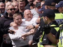 Riots break out in Manchester and Hull as police seen battling thugs amid reports of ‘stabbing’ in Stoke while chaos from protests organised after Southport horror continues across the UK