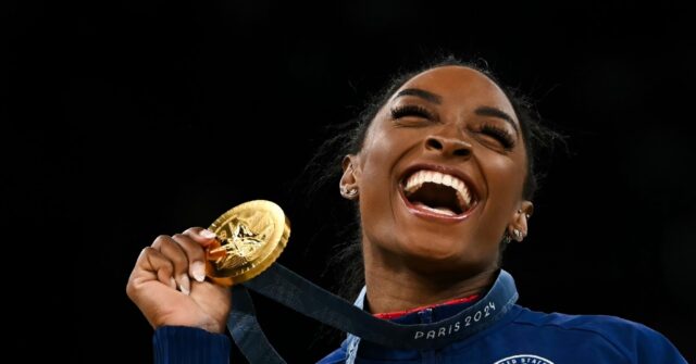 Beaming Biles bags Olympic gymnastics triple, as women’s 100m final looms