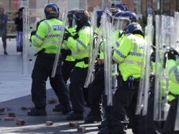 Terrified families who brought their children to see Disney Princess cruise in Liverpool where violent riots broke out flee for their lives after mob of 1,500 clash in violent running battles through the city centre