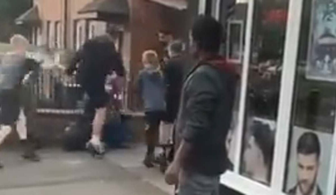 Moment ‘gang of feral children’ attack man, knocking him to the floor before stamping on his head in sickening assault outside of barber shop