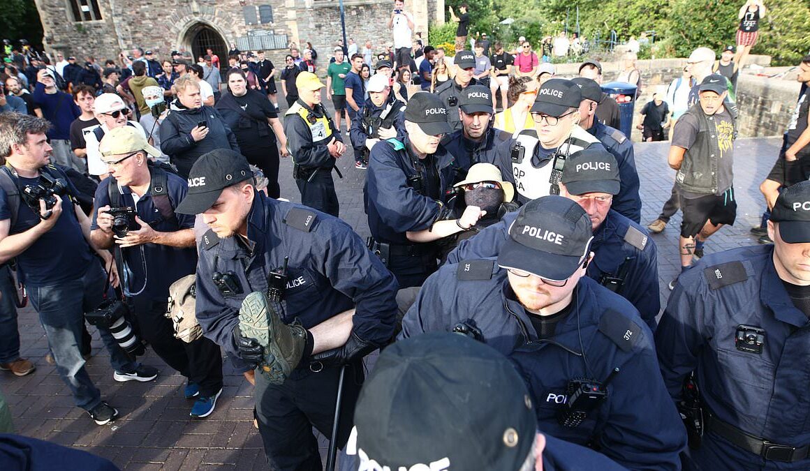 Tinderbox Britain’s week of shame: How days of riots and looting saw police cars torched, shops broken into and innocent passers-by attacked (plus THAT protester getting hit by a brick)