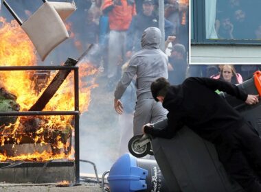 BREAKING NEWSBalaclava-clad baying mob storm migrant hotel, hurl chairs at riot police and set fire to furniture while terrified asylum seekers watch on from rooms in latest violent riots