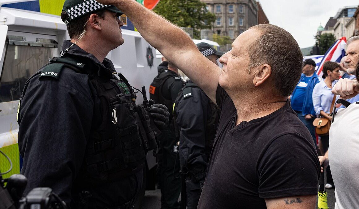 Britain’s disturbing underbelly hijacking the Southport tragedy: How far-right groups have organised violent riots on streets across the country – as footage emerges of one protester proudly showing off a Nazi tattoo