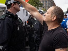 Britain’s disturbing underbelly hijacking the Southport tragedy: How far-right groups have organised violent riots on streets across the country – as footage emerges of one protester proudly showing off a Nazi tattoo