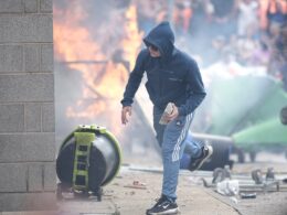 First country issues warning over travelling to the UK amid violent protests – as it urges citizens living in Britain to ‘remain vigilant’