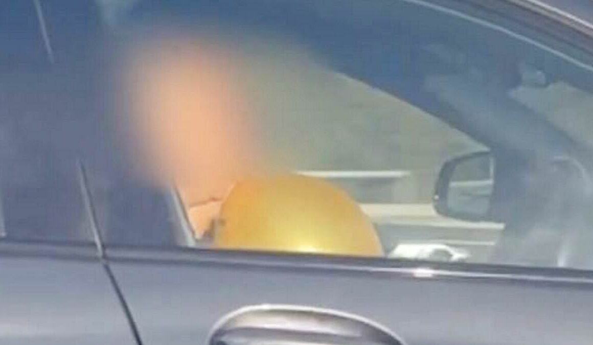 Shocking moment BMW driver ‘inhales hippy crack balloon’ while on the motorway as police release montage of motorists being caught red-handed