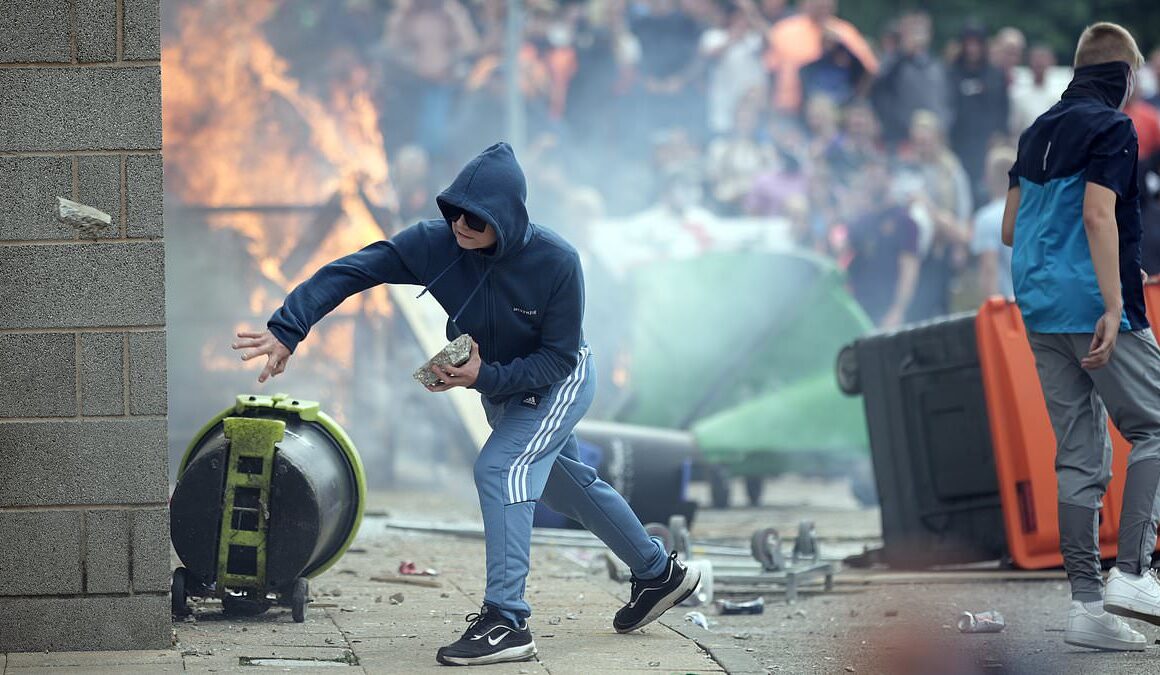 Home Secretary threatens ‘reckoning’ for race rioters after mobs set fire to migrant hotels, battered police and caused havoc: Government will also target those who ‘whipped up’ frenzy online – with HUNDREDS arrested and first people charged