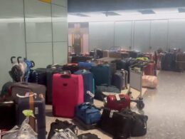 Airline bosses battle to clear baggage chaos at Heathrow after mountains of luggage are left to pile up after 60 British Airways flights are cancelled due to torrential rain and thunder in Europe