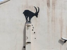 Banksy unveils latest mysterious piece: Silhouette of a goat appears on a wall near the River Thames in London as legendary street artist confirms the work is his