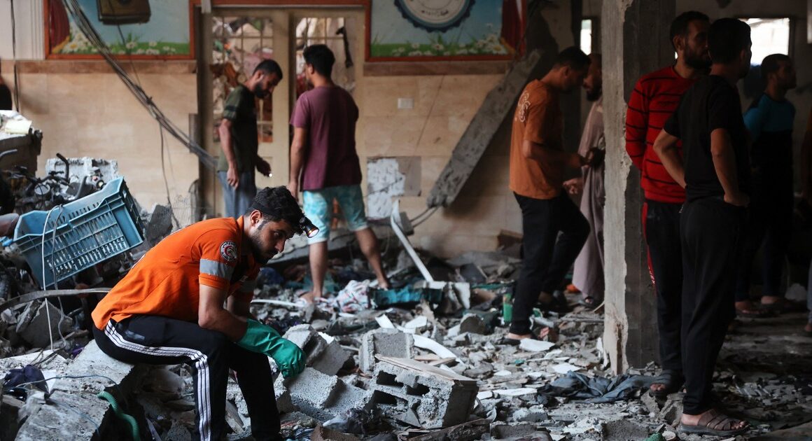 At least 100 killed by Israeli strike on a school where thousands were sheltering, officials say