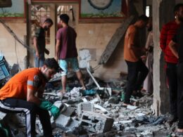 At least 100 killed by Israeli strike on a school where thousands were sheltering, officials say