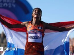 Hassan wins marathon to claim third Paris medal