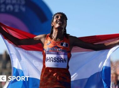 Hassan wins marathon to claim third Paris medal