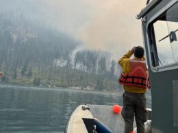 With a fire burning just miles away, residents of a Washington town dig in