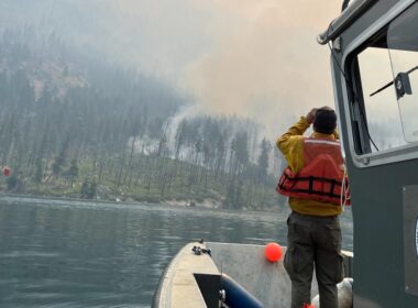 With a fire burning just miles away, residents of a Washington town dig in