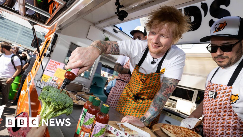 Ed Sheeran signs hot sauce autographs in car park