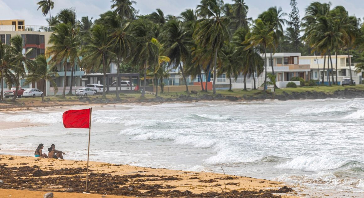 Thousands in Puerto Rico without power and under flood threats as Ernesto turns into a hurricane