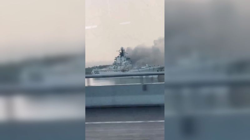 Old aircraft carrier, once part of mighty Soviet fleet, burns in Chinese lagoon