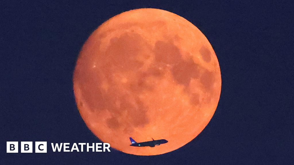 In pictures: Blue supermoon glows red