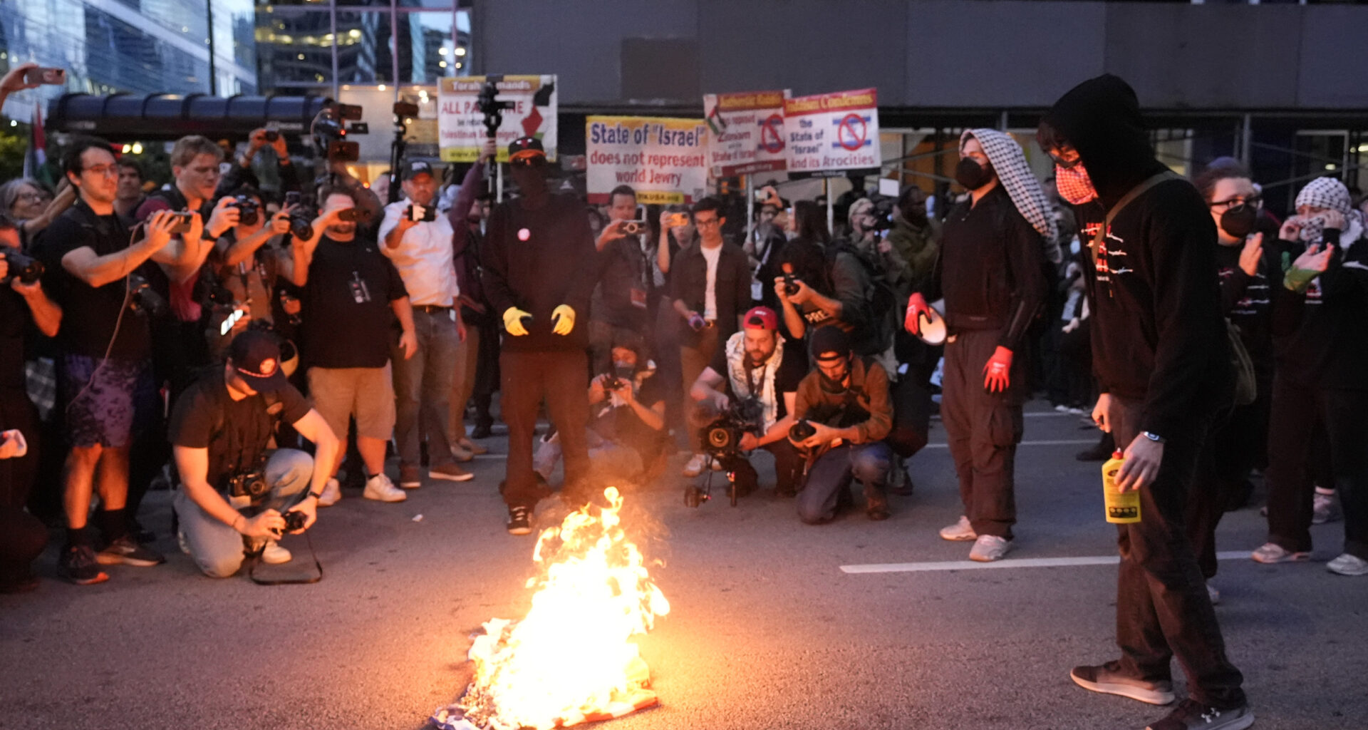 Man Tries to Rescue American Flag Burning Near DNC