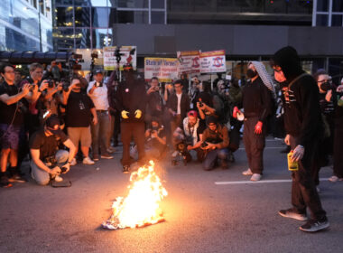 Man Tries to Rescue American Flag Burning Near DNC